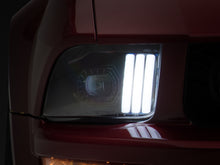 Load image into Gallery viewer, Raxiom 05-09 Ford Mustang w/ Halogen Projector Headlights- Black Housing (Clear Lens) (No GT500 )