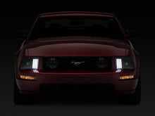 Load image into Gallery viewer, Raxiom 05-09 Ford Mustang w/ Halogen Projector Headlights- Black Housing (Clear Lens) (No GT500 )